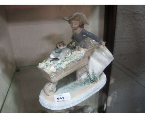 A LLADRO FIGURE of a young girl wheeling her puppies 