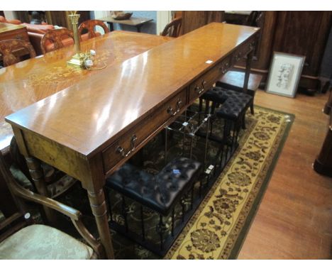 A GOOD WALNUT SIDE TABLE by "Theodore Alexander" with three frieze drawers above turned tapering legs 100cm (h) x 198cm (w)