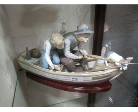A LLADRO FIGURE of a elderly Italian gentleman fishing from his boat