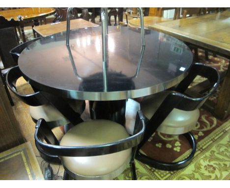 A WILLY RIZZO CIRCULAR DINING TABLE with black top and chrome band on a single pedestal with chrome pedestal base