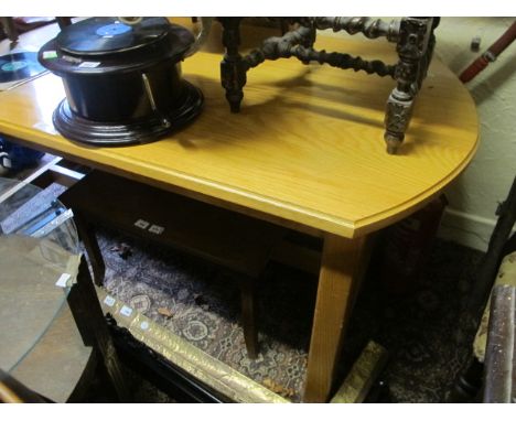 AN OAK TABLE of rectangular bowed outline raised on square moulded legs