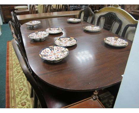 A GEORGIAN STYLE MAHOGANY D-END DINING TABLE the rectangular top with rounded ends and one loose leaf raised on twin tripod s