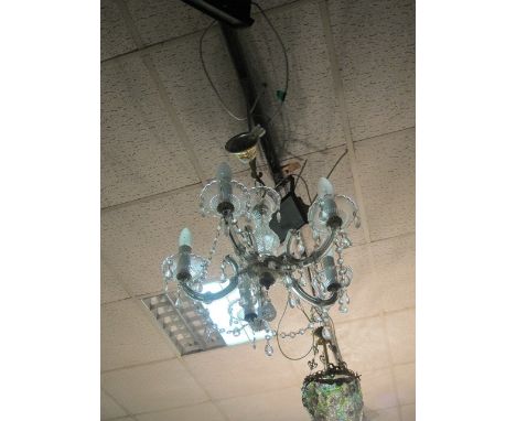 A MOULDED GLASS FIVE LIGHT HANGING CHANDELIER decorated with swags and drops