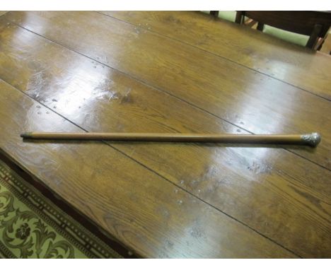 A SILVER TOPPED AND SATINWOOD WALKING STICK with a brass tip