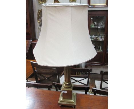 A BRASS CORINTHIAN COLUMN LAMP with shade