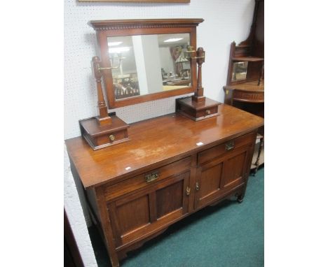 A LATE VICTORIAN MAHOGANY DRESSING TABLE with swing mirror and panel doors below 141cm wide