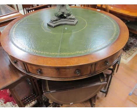 A GOOD WALNUT DRUM TABLE with inset leather top frieze drawers and outswept pillar support 122cm wide