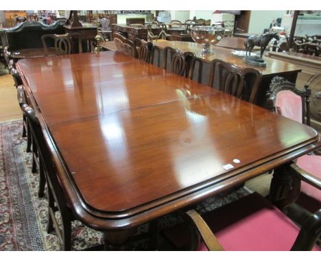 A FINE DINING ROOM SUITE comprising an extending William IV style dining table with two inset leaves and turned lobed legs 12