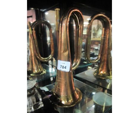 A COPPER AND BRASS BUGLE inscribed "Class A Boosey & Company London"