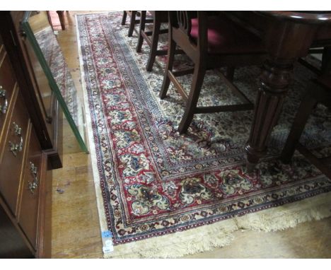 A KASHMIR BELGIUM RUG the beige, wine and light blue ground with central floral panel within a conforming border 300cm x 195c