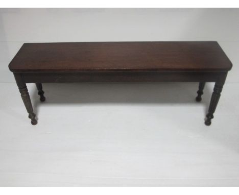 A REGENCY MAHOGANY LONG BENCH on turned lobed legs 126cm wide