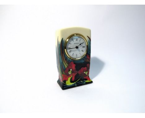 A Moorcroft Satin Flower pattern clock designed by Nicola Slaney, 16cm tall, boxed