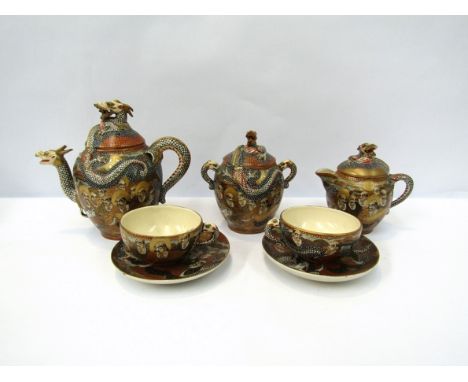 A Japanese Satsuma ware tea set consisting of teapot, six cups and saucers, milk jug and lidded sucrier. Figural scenes with 