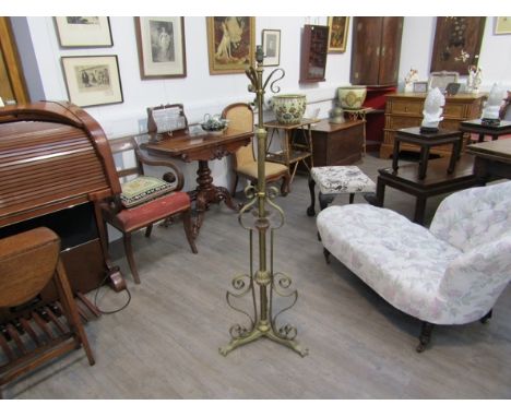 A late 19th Century Arts &amp; Crafts brass and copper telescopic standard lamp on paw feet 
