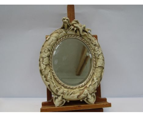 A ceramic ivory imitation mirror of Oriental taste, possibly Worcester, 38cm tall