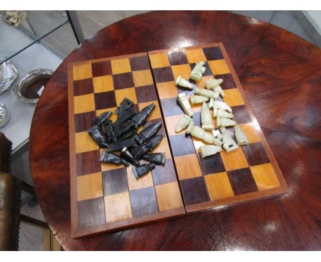 A late 19th/ early 20th Century chess set with jade pieces.&nbsp; One piece a/f