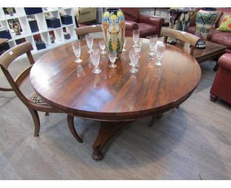 A 19th Century rosewood breakfast table with tripod base, some veneer missing, 130cm diameter x 75cm tall