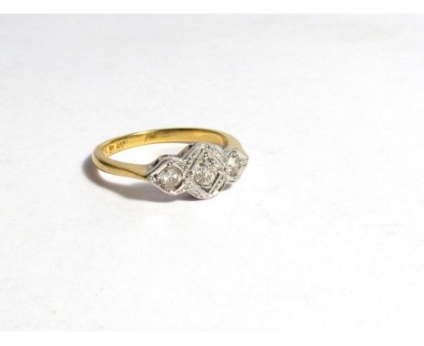 A three stone diamond set ring, shank marked 18ct plat, size I 1/2