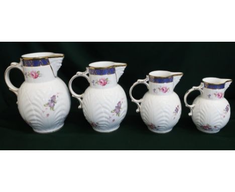 Set of four Coalport reproduction "Caughley Mask-Head" graduated jugs (4) 