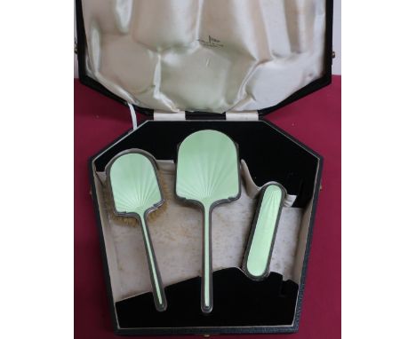 Geo.VI silver and green enamel backed three piece dressing table set, Chester 1938, by Walker &amp; Hall, in fitted case, lac