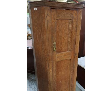 20th C oak hall wardrobe, with panel door enclosed by canted corners W71cm H177cm D33cm 