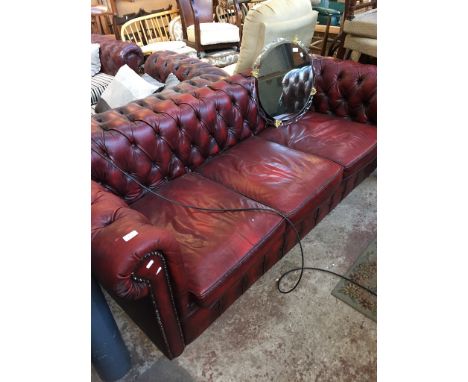 OXBLOOD LEATHER THREE SEATER CHESTERFIELD SETTEE AND POUFFE