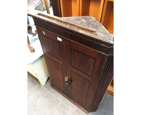 AN OAK CORNER CABINET