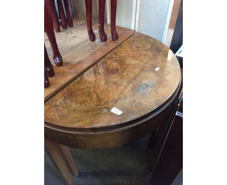 A WALNUT VENEERED DEMI LUNE CARD TABLE