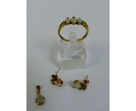 Three opal and diamond ring, tested as 9ct gold, size P with opal pendant and matching opal earrings