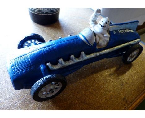 Hubley cast metal original Michelin Man in vintage sports car, 1934