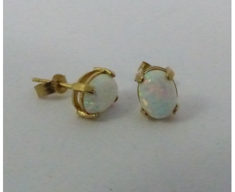 Pair of  9 ct gold and opal earrings