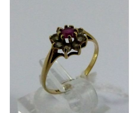 Ladies 9ct gold flower ring, ruby and white stones design, size M