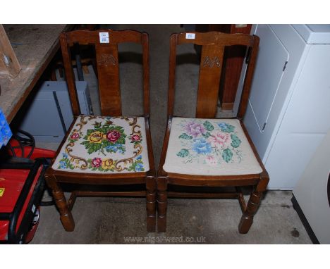 Pair of Oak dining chairs with floral tapestry covered seats.