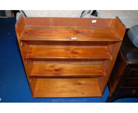 A Pine four shelf bookcase, 35" x 10" x 39" high.