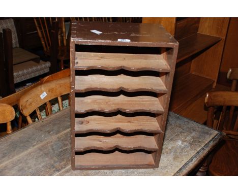 An old stained-Pine, table-top, six-shelf stationery/music storage unit, 13 1/2" x 10" x 20" high.