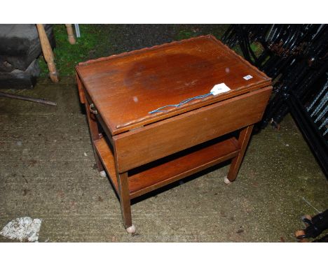 A drop-leaf tea-table with drawer and lower shelf.