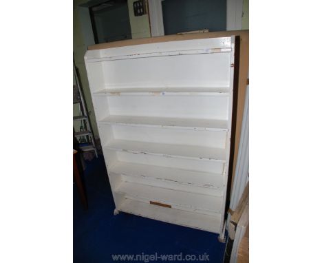 A seven shelf white painted bookcase, 41" x 7" x 62" high.