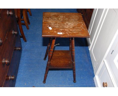 An Oak Arts &amp; Crafts square-topped occasional table, the turned legs united by a lower shelf, 16" x 16" x 29" high.