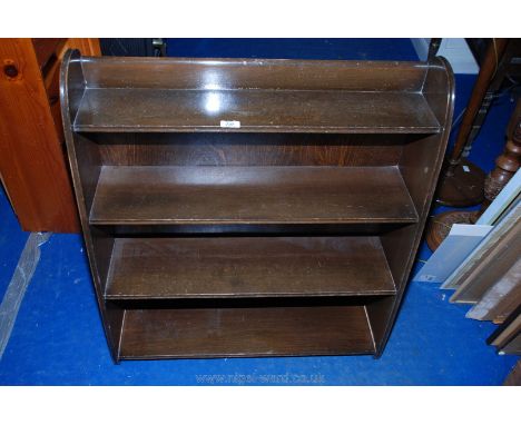 A dark Mahogany four-shelf bookcase by 'Remploy', 30" x 10" x 35".