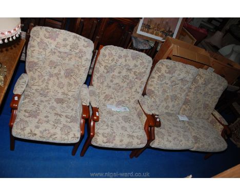 Two "Cintique" Winchester style armchairs and a matching two-seat sofa.