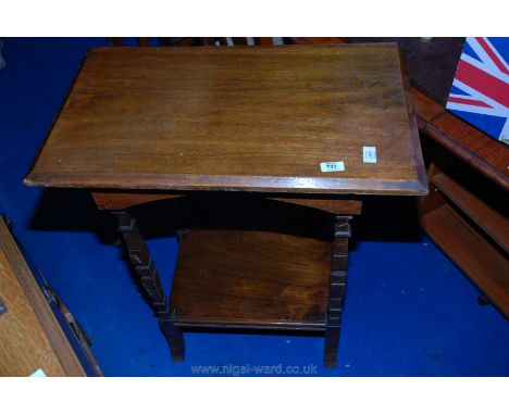 A rectangular Mahogany table with under shelf having unusual square tapered legs 27" x 16" x 31" tall.