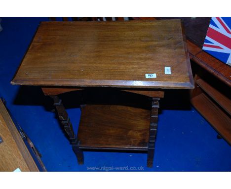 A rectangular Mahogany table with under shelf having unusual square tapered legs 27" x 16" x 31" tall.