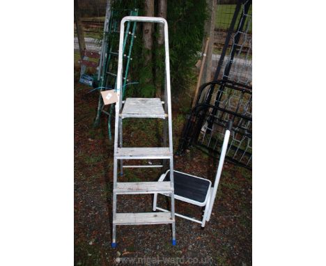 A three rung step ladder and a step stool.