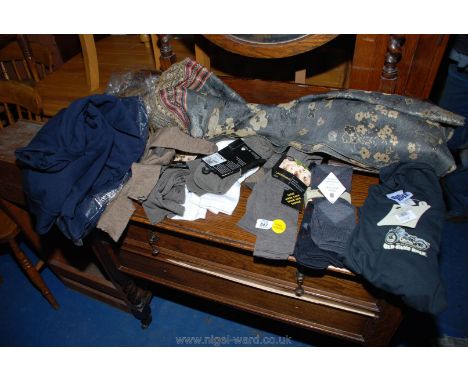 A quantity of new lambs-wool socks, jumpers, scarf, etc.,