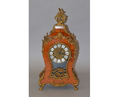 A reproduction French style chiming mantle clock with walnut burr and ormalu style design, with Herlme movement, key and pend
