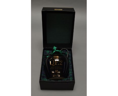 Whiskey: A boxed QE2 12 year old Single Malt Scotch Whiskey in ceramic decanter with wax seal intact.