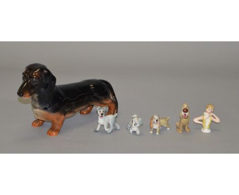 A Beswick Daschhund togther with 4 Disney Wade Whimsies and a pin cushion lady (6)