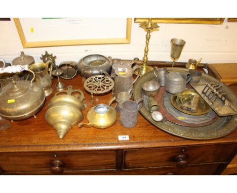 A large quantity of various metalware to include trays; goblets; tankards; a teapot etc.