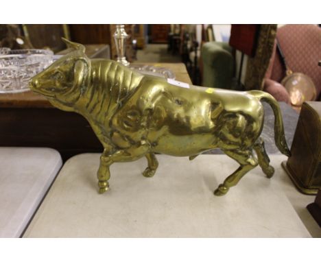 A large brass model bull