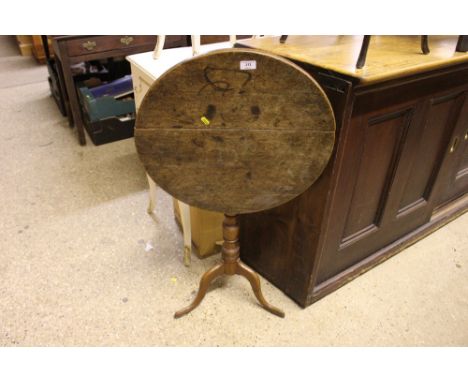 A Georgian oak tilt top tripod table